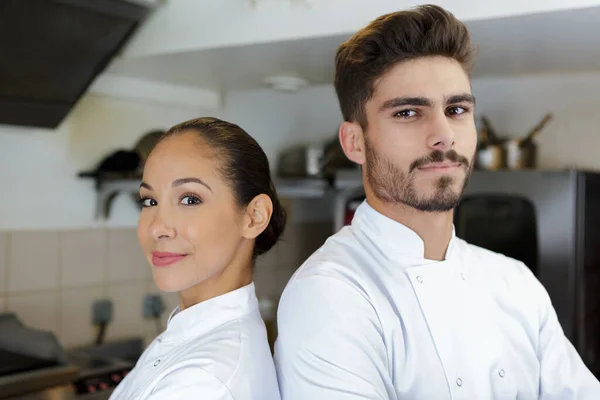 happy young man and woman in chef