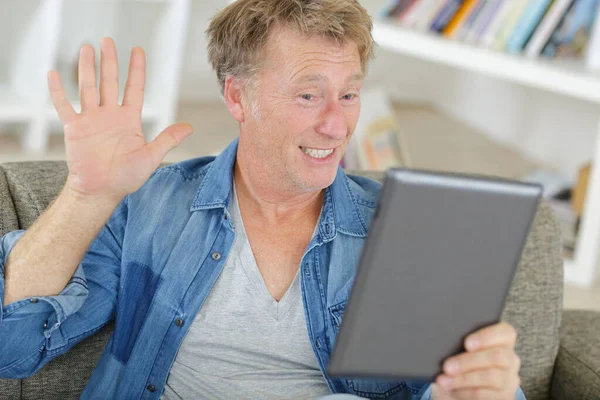 Smiling Man Waving Tablet — Stock Photo, Image
