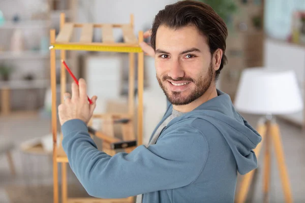 Concentrated Young Man Assemble Furniture Home — Stock Photo, Image