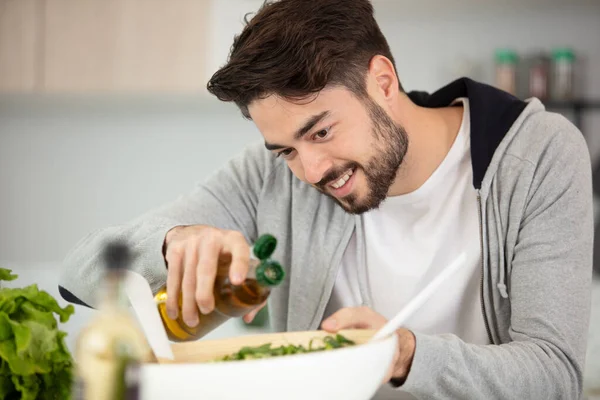 Man Adding Spice Salad Smiling — Stock Photo, Image