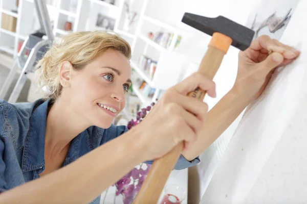 beautiful woman with a hammer