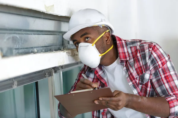 Worker Protective Cloths Checking Clipboard — Stock Photo, Image