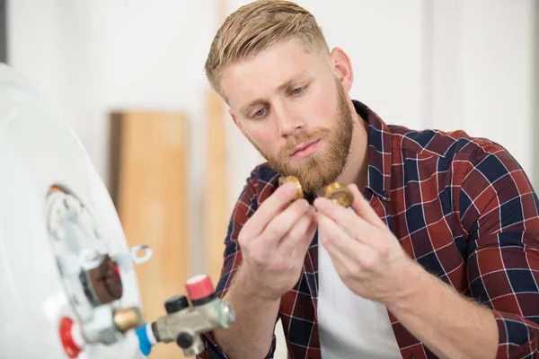 Young Male Plumber Checking Fittings Boiler — Stock Photo, Image