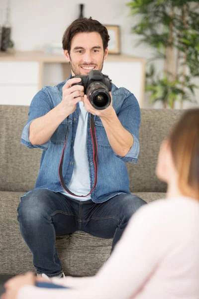 professional photographer taking photos of model