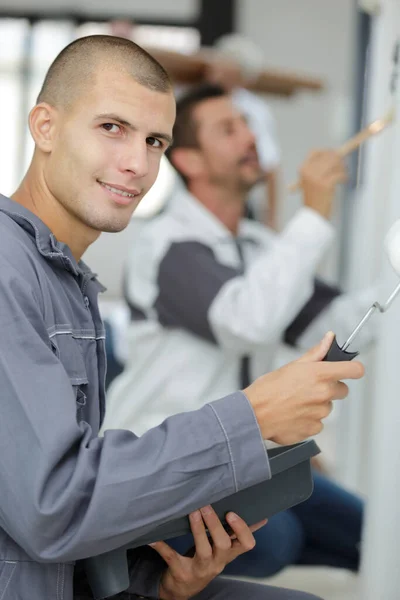 young apprentice painter in professional training