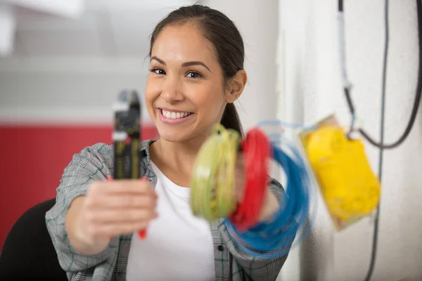 Female Electrician Holding Cable Cutters Reels Coloured Cable — Stock Photo, Image