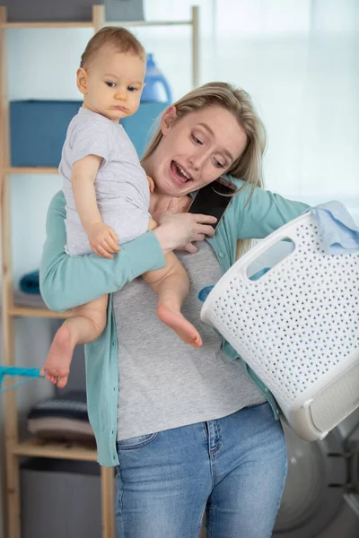 screaming young mother fed up with doing the laundry