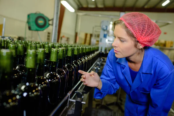 a female bottle factory worker