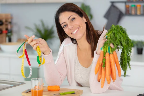 Charming Woman Holding Bunch Carrots Tape Measure — Stock Photo, Image