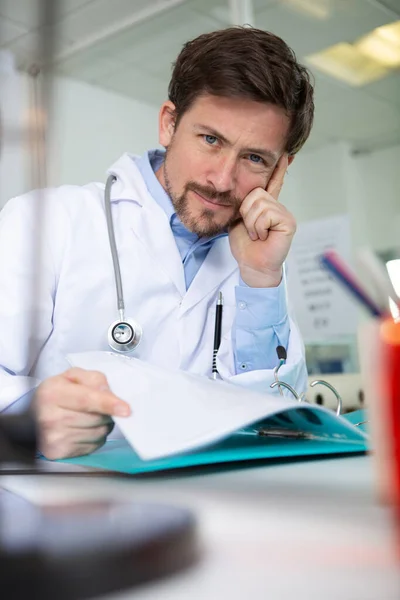 doctor looking at camera in medical office