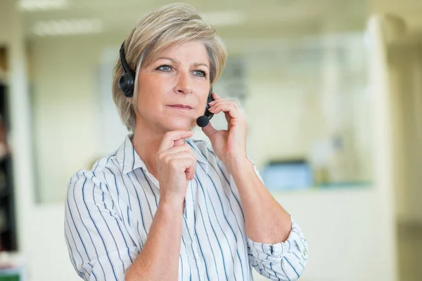 portrait of support phone operator in headset
