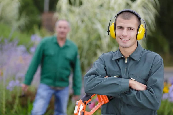 Young Male Gardener Posing Older Colleague Background — Stock fotografie