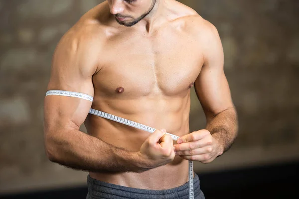 Picture Man Measuring His Arm Muscle — Fotografia de Stock