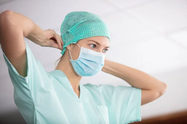 Female Nurse Puts Surgical Mask — Stock Photo, Image