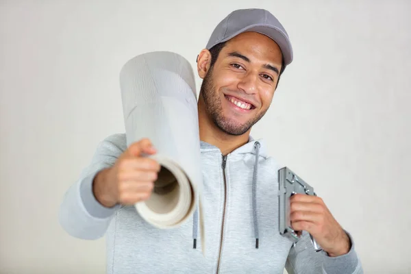 Home Improvement Concept Young Man Carrying Wallpaper —  Fotos de Stock