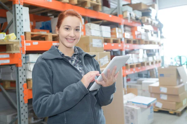 Young Warehouse Worker Holding Tablet — Stock Photo, Image