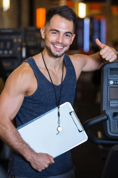 Male Personal Trainer Gym Holding Thumbs — Stockfoto