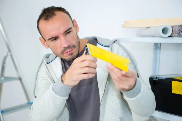 Worker Checking Plastic Piece — Foto Stock