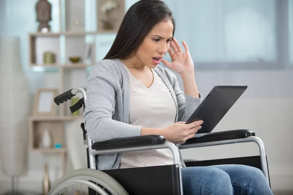 Shocked Young Woman Wheelchair Using Tablet Isolated White — Stockfoto