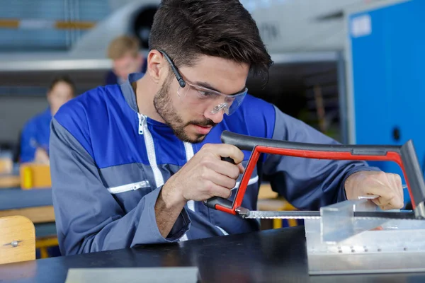 Young Worker Cutting Metal Frame — Stock Photo, Image