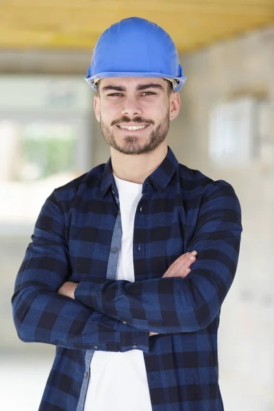 portrait of young tradesman with his arms crossed