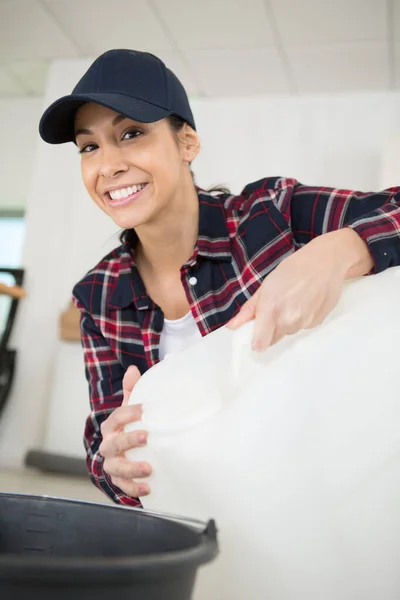 Happy Female Worker Holding White Plastic Container — Fotografia de Stock
