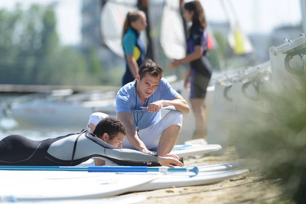 stock image stand up and paddle lesson