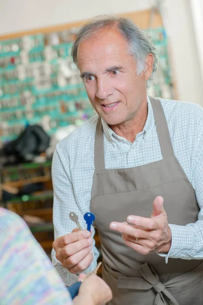 Shopkeeper Holding Out Key Duplicates His Client — Stock Photo, Image
