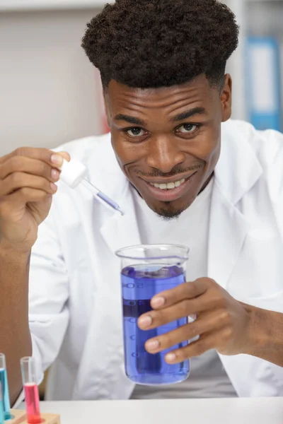 Young Male Scientist Holding Flask Liquid Pipette — Stockfoto