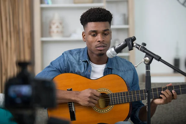 black man playing guitar