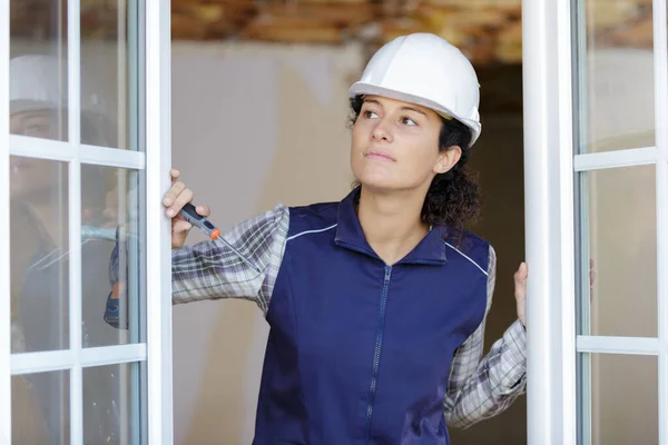Portrait Female Worker Checking Windows — Foto Stock