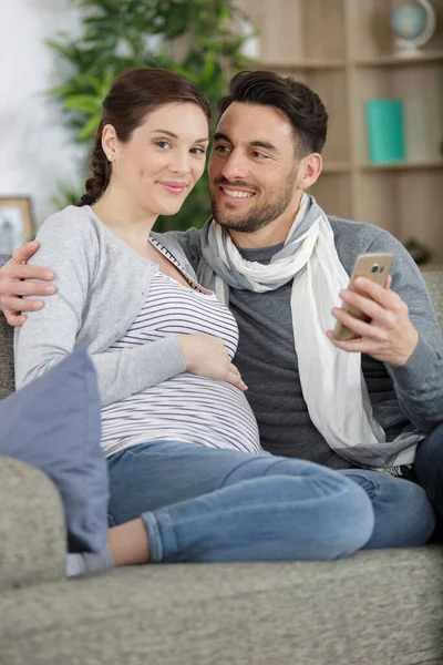 Smiling Beautiful Couple Hugging Each Other Looking Phone — Stock Photo, Image