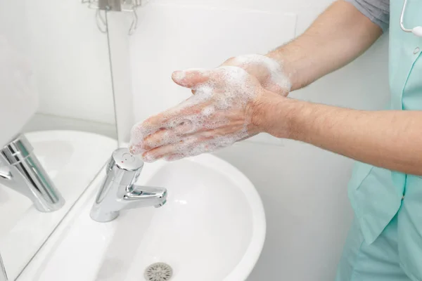 doctor washing hands before operating