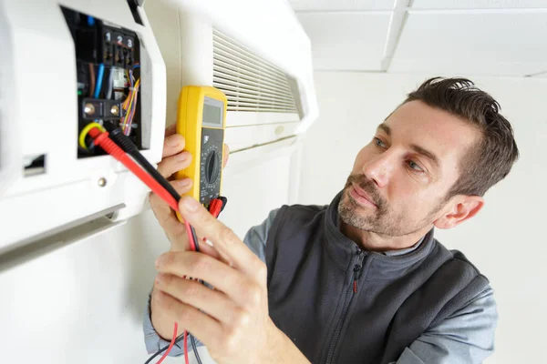 electrician technician working on a residential electrical panel