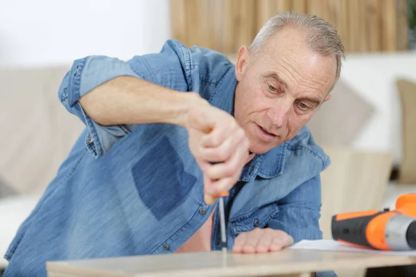 Mature Man Screwing Screws Furniture Fittings — Stock Photo, Image