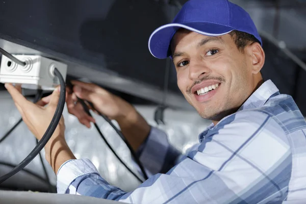 Happy Man Installing Mounting Cables Concrete Ceiling — Stock Photo, Image