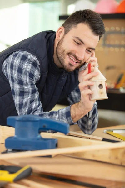 Happy Young Carpenter Talking Phone — Stock Photo, Image