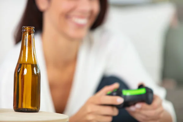 Woman Playing Video Games Having Beer — Stockfoto