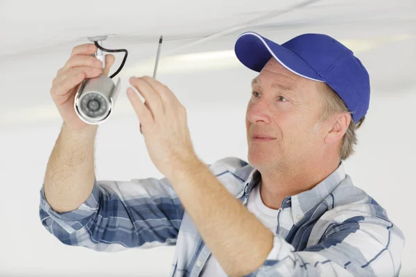 Mature Contractor Installing Cctv Camera Ceiling — Stock Photo, Image
