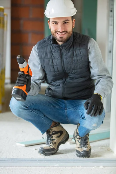 Handsome Builder Drill Indoors — Stock Photo, Image