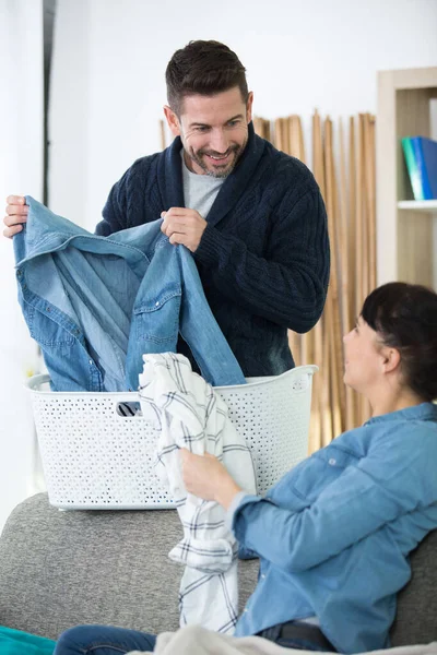 Cheerful Couple Sorting Laundry Together — Stock Photo, Image