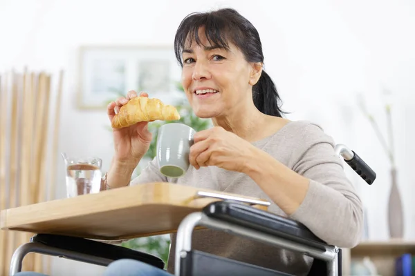 Mature Woman Wheelchair Having Breakfast — Stok fotoğraf