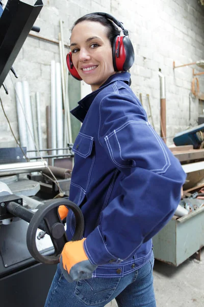 woman working with pressure valve