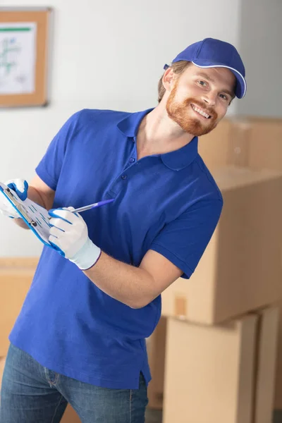 Delivery Man Unloading Cardboard Boxes — Stock Photo, Image