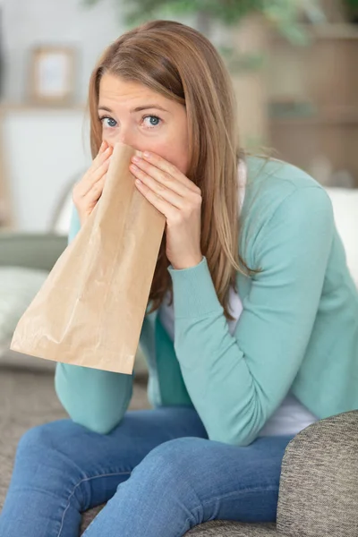 Young Woman Breathing Paper Bag — Stock Photo, Image