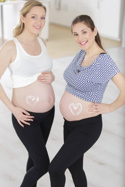 Happy Pregnant Women Showing Belly — Stock Photo, Image