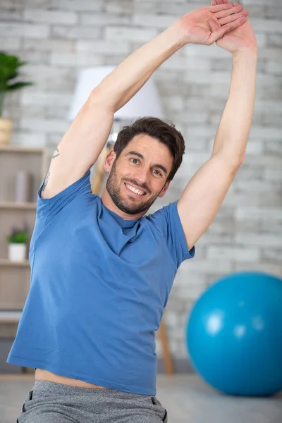 Man Exercising Arms Raised His Head — Stockfoto