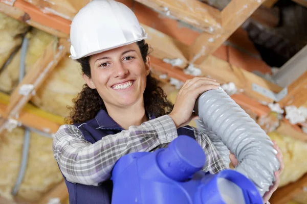 Happy Female Worker Holding Ventilation Pipes — Stok fotoğraf