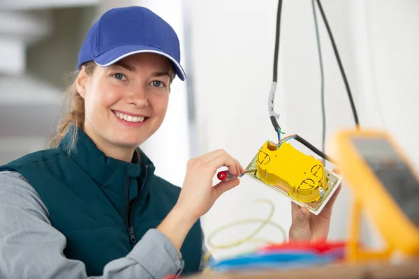 stock image female electrician is happy at work