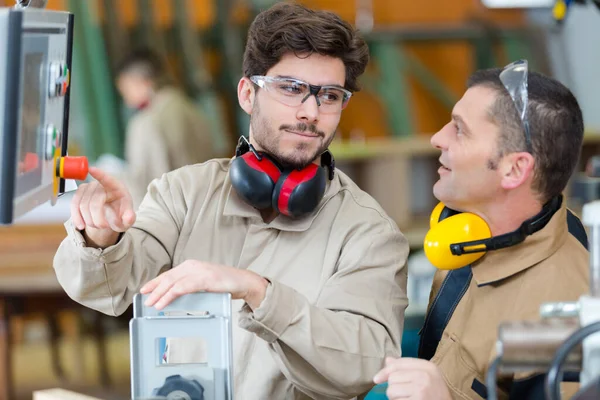 Young Machine Operator Pointing Button — Stock Photo, Image